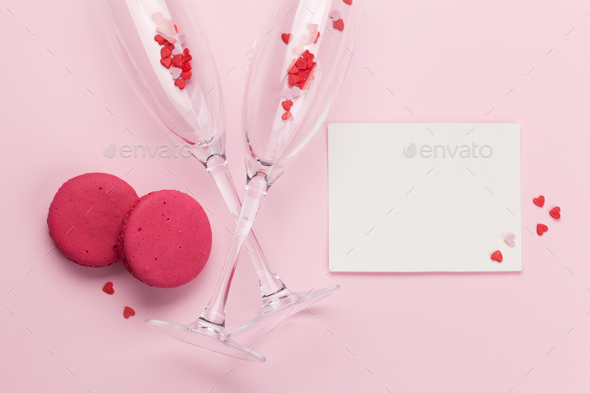 Champagne glasses and heart shaped sweets holiday - Stock Photo - Images