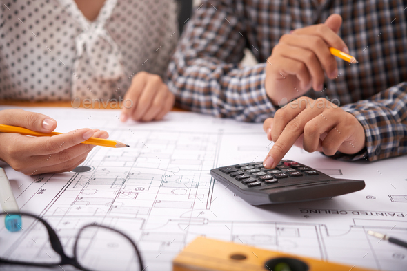 Discussing cost of construction - Stock Photo - Images