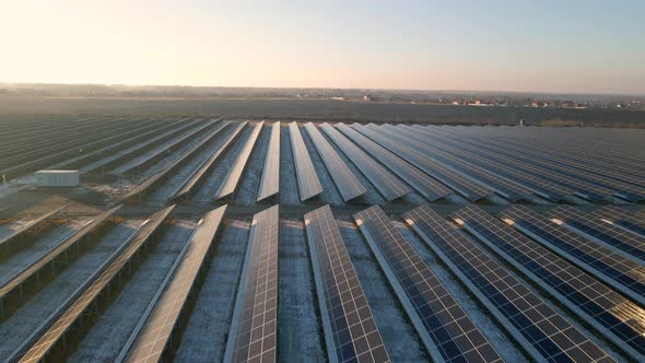 Aerial View of Solar Panels Stand in a Row in the Fields Power Ecology Innovation Nature Environment alt
