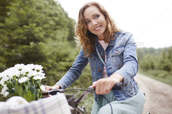 Happy cyclist riding in forest