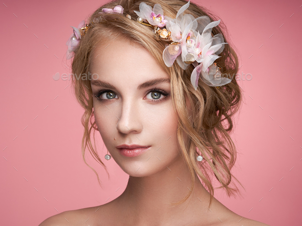 Young blonde woman with tiara on her head - Stock Photo - Images