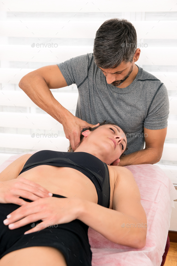 Osteopath performing cervical trust therapy