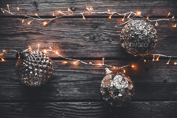 Christmas or New Year background. Vintage Christmas tree toy decoration balls and light garland - Stock Photo - Images
