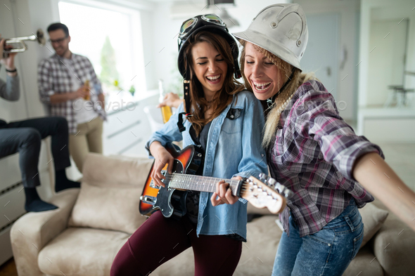 Group of friends having fun together, talking, laughing and enjoying their time - Stock Photo - Images