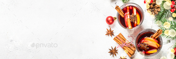 Mulled wine with christmas decorations on white - Stock Photo - Images