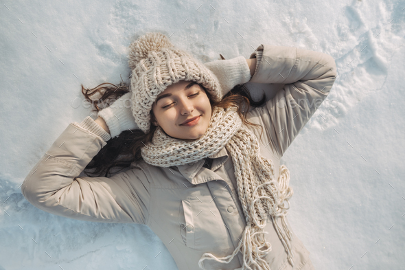 Woman Lying on the Snow - Stock Photo - Images