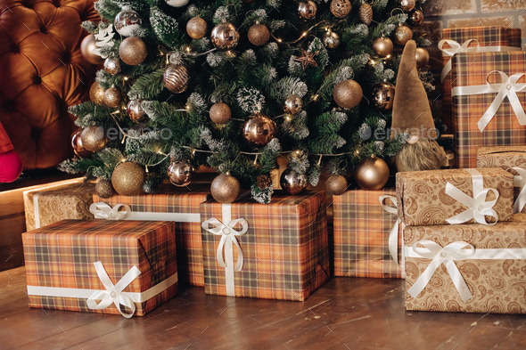 Wrapped Christmas presents under the tree. Christmas tree - Stock Photo - Images