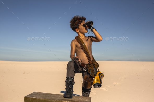 Post-apocalyptic boy outdoors in desert