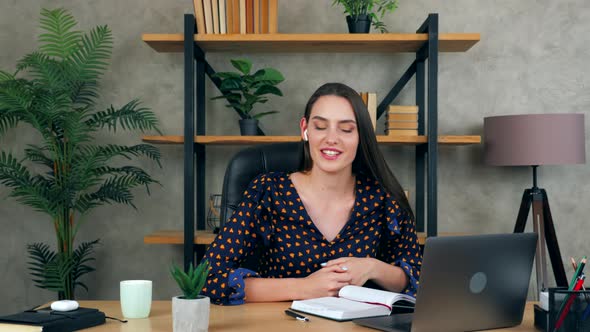 Smiling emotional woman in home office tells teacher remote video conference call webcam laptop alt