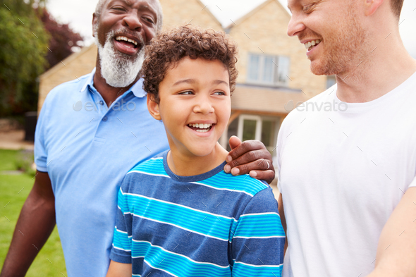 Father With Son And Grandfather From Multi-Generation Mixed Race Family Walking In Garden At Home - Stock Photo - Images
