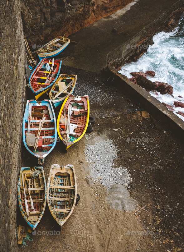 Local traditional fishing boats under shelter during storm in atlantic ocean. View from above, view - Stock Photo - Images