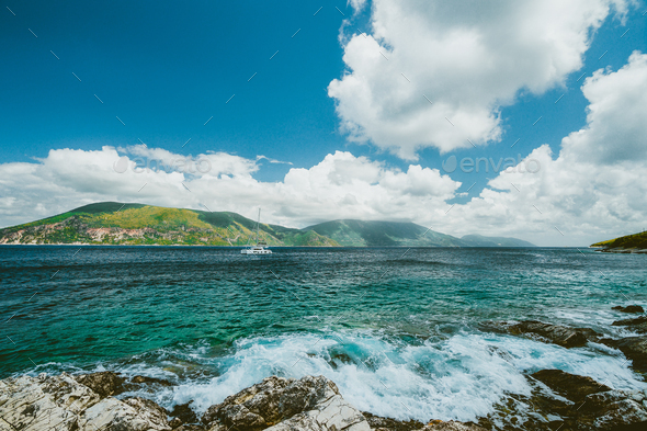 Beautiful cloudscape near Fiskardo, Kefalonia, Ionian islands, Greece. Crystal clear transparent - Stock Photo - Images