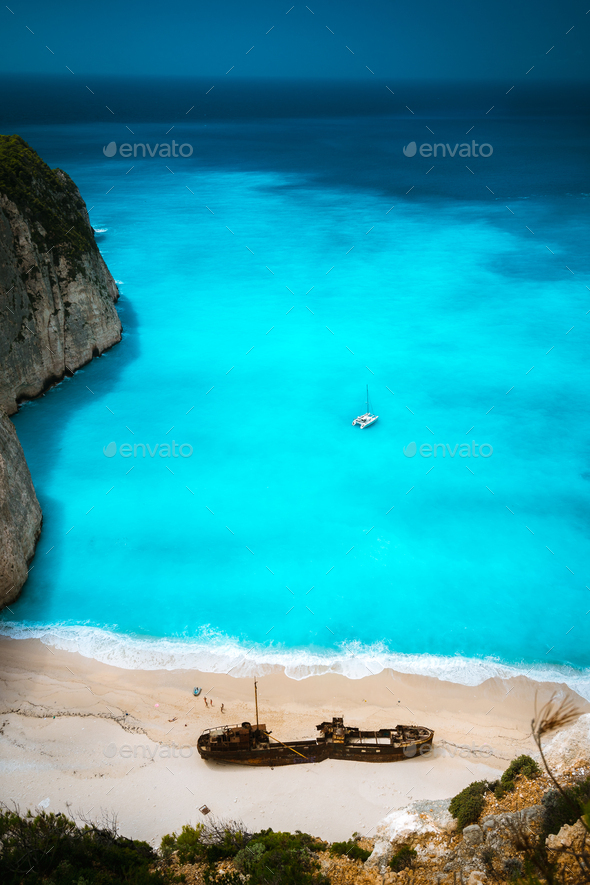 Shipwreck in Famous Navagio beach. Azure turquoise sea water and paradise sandy beach. Tourist - Stock Photo - Images