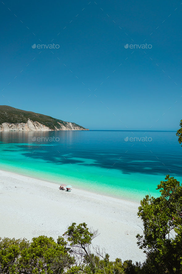 Couple enjoying the summer on one of the most beautiful beaches of Greece on Kefalonia Island Ionian - Stock Photo - Images