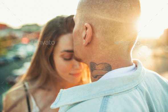 Tanned young caucasian couple, modern lovestory in film grain effect - Stock Photo - Images