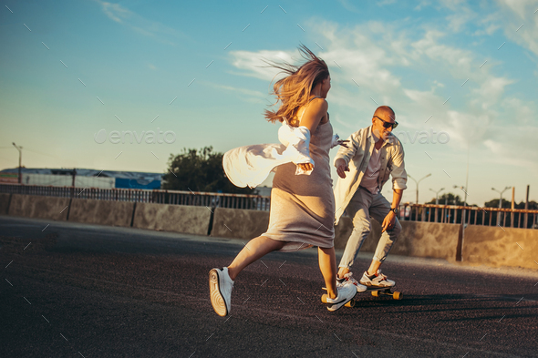 Tanned young caucasian couple, modern lovestory in film grain effect - Stock Photo - Images