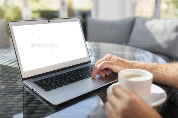 Laptop computer on desk working in cafe or office with blank scr - Stock Photo - Images