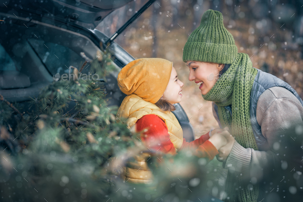 Mother, child and car on snowy winter nature - Stock Photo - Images