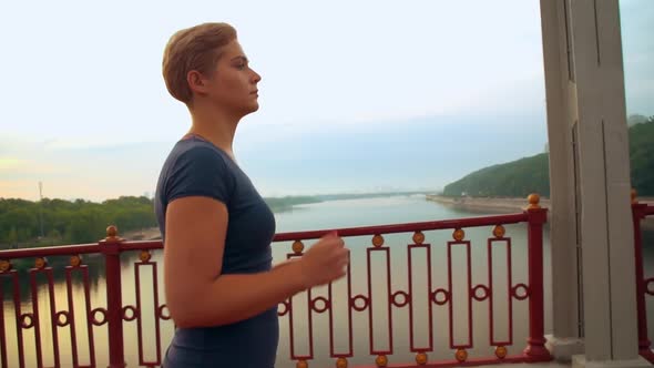 Girl with Blond Hair Runs in City alt