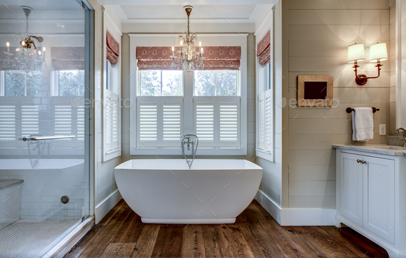 High End Bathroom With Large White Bathtub And Shiplap Siding