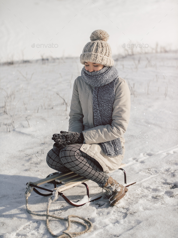 Woman with Sled Outdoors - Stock Photo - Images