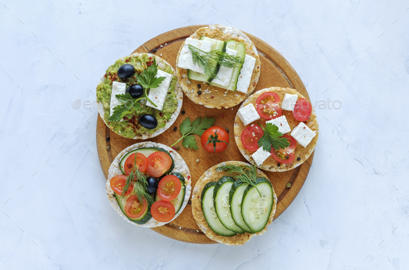 Homemade delicious appetizers on rice cakes - Stock Photo - Images