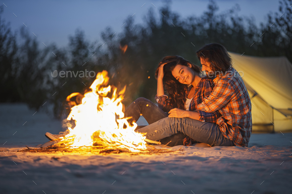 Couple Camping Near Campfire - Stock Photo - Images