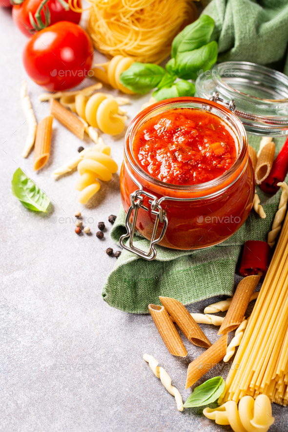 Glass jar with homemade classic spicy tomato pasta or pizza sauce. - Stock Photo - Images