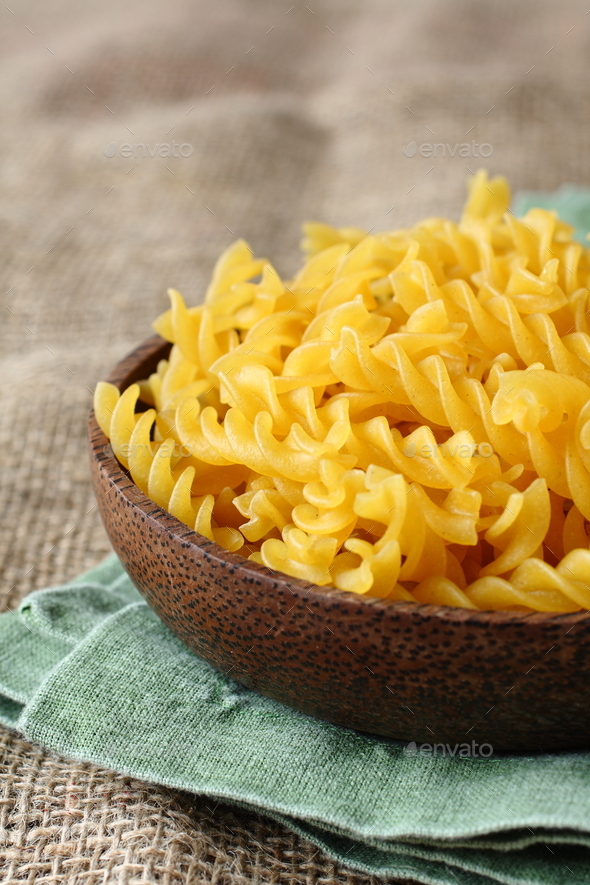 ncooked gluten free fusilli pasta from blend of corn and rice flour