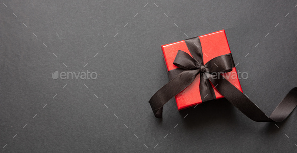Red gift box with gold ribbon on red background, view from above, copy  space Stock Photo by rawf8