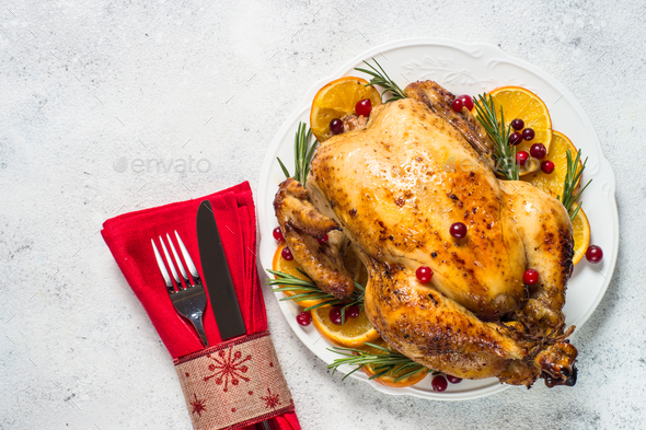 Chrismas chicken baked with cranberry, orange and rosemary. Christmas food - Stock Photo - Images