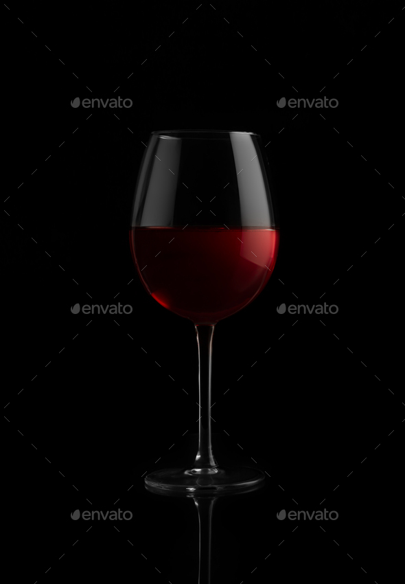 Red wine glass on a black background - Stock Photo - Images