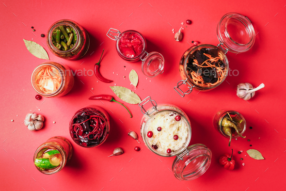 Probiotics food background. Korean carrot, kimchi, beetroot, sauerkraut, pickled cucumbers in glass - Stock Photo - Images