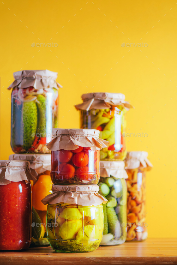Preserved and fermented food in glass jars. Fermented food. Autumn canning. ?ucumber, squash and - Stock Photo - Images