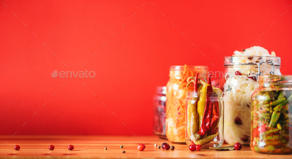 Probiotics food background. Korean carrot, kimchi, beetroot, sauerkraut, pickled cucumbers in glass - Stock Photo - Images