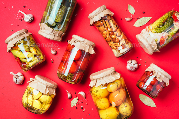 ?ucumber, squash and tomatoes pickling and canning into glass jars. Ingredients for vegetables - Stock Photo - Images
