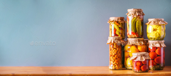 ?ucumber, squash and tomatoes pickling and canning into glass jars. Ingredients for vegetables - Stock Photo - Images
