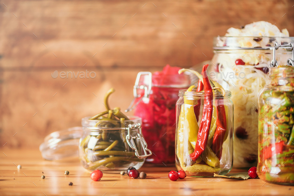 Assortment of various fermented and marinated food over wooden background, copy space. Fermented - Stock Photo - Images