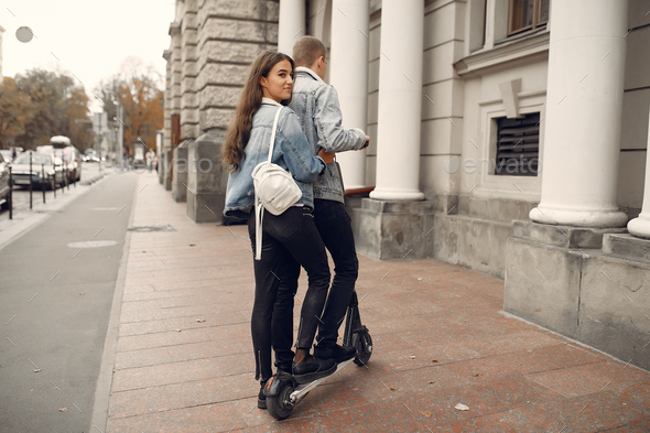 Beautiful couple spend time in a autumn city