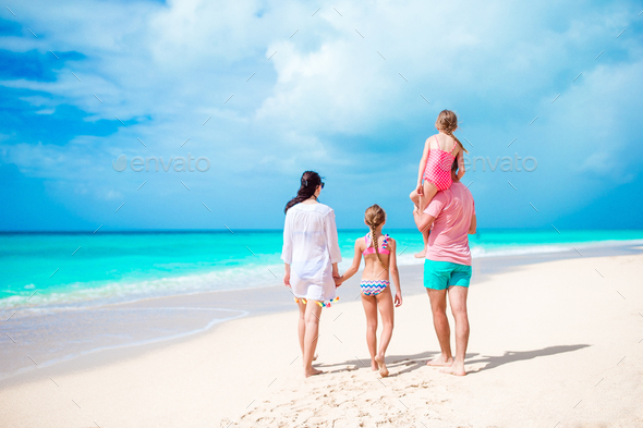 Back view of family on Caribbean vacation