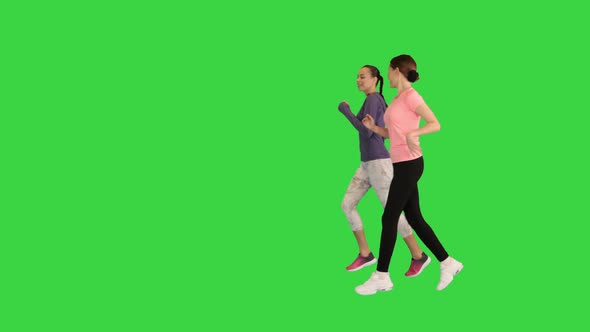 Group of Two Runner Women Running on a Green Screen Chroma Key alt