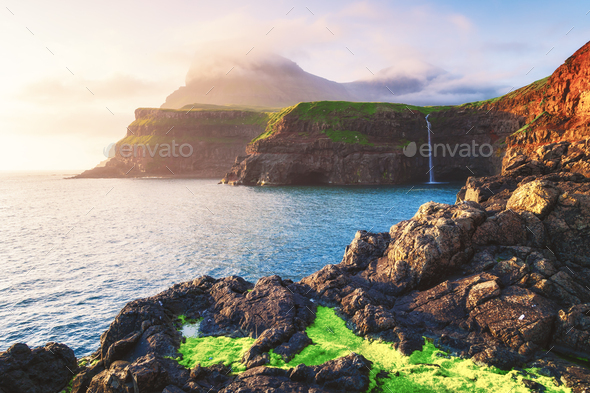 Mulafossur waterfall in Gasadalur, Vagar Island of the Faroe Islands - Stock Photo - Images