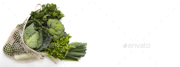 Green vegetables for tasty vegetarian salad in reusable shopping bag - Stock Photo - Images