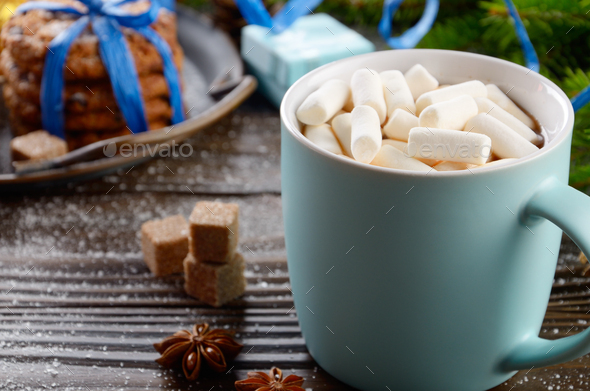 Christmas background of blue hot chocolate mug with marshmallows - Stock Photo - Images