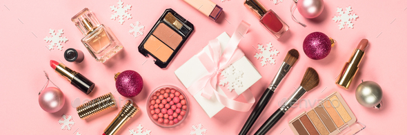 Makeup professional cosmetics with christmas decor on pink - Stock Photo - Images