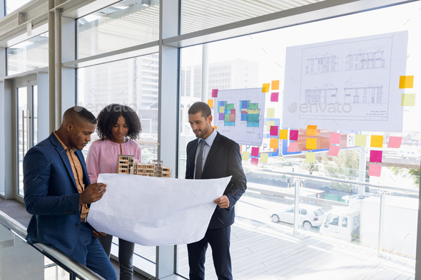 Three young architects working together - Stock Photo - Images