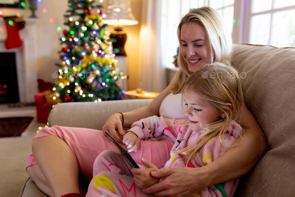 Family at home at Christmas time - Stock Photo - Images