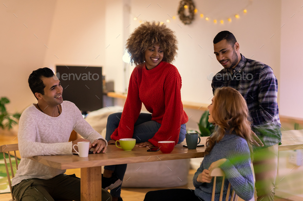 Millennial adult friends socialising together at home - Stock Photo - Images