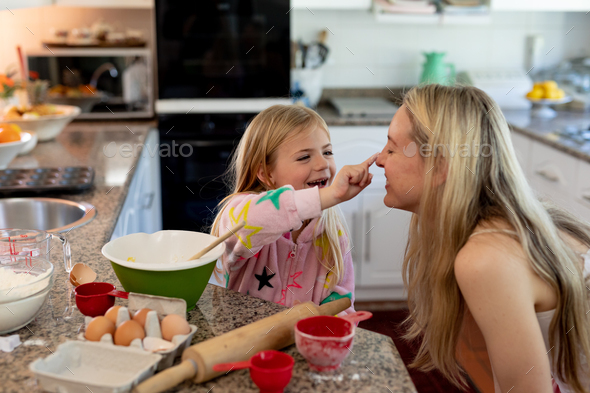Family making Christmas cookies at home - Stock Photo - Images