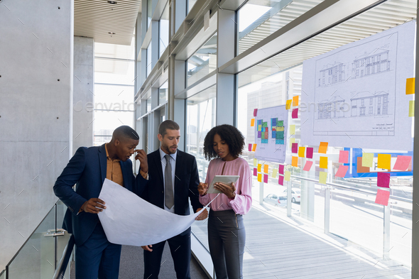 Diverse young architect team working in modern office - Stock Photo - Images